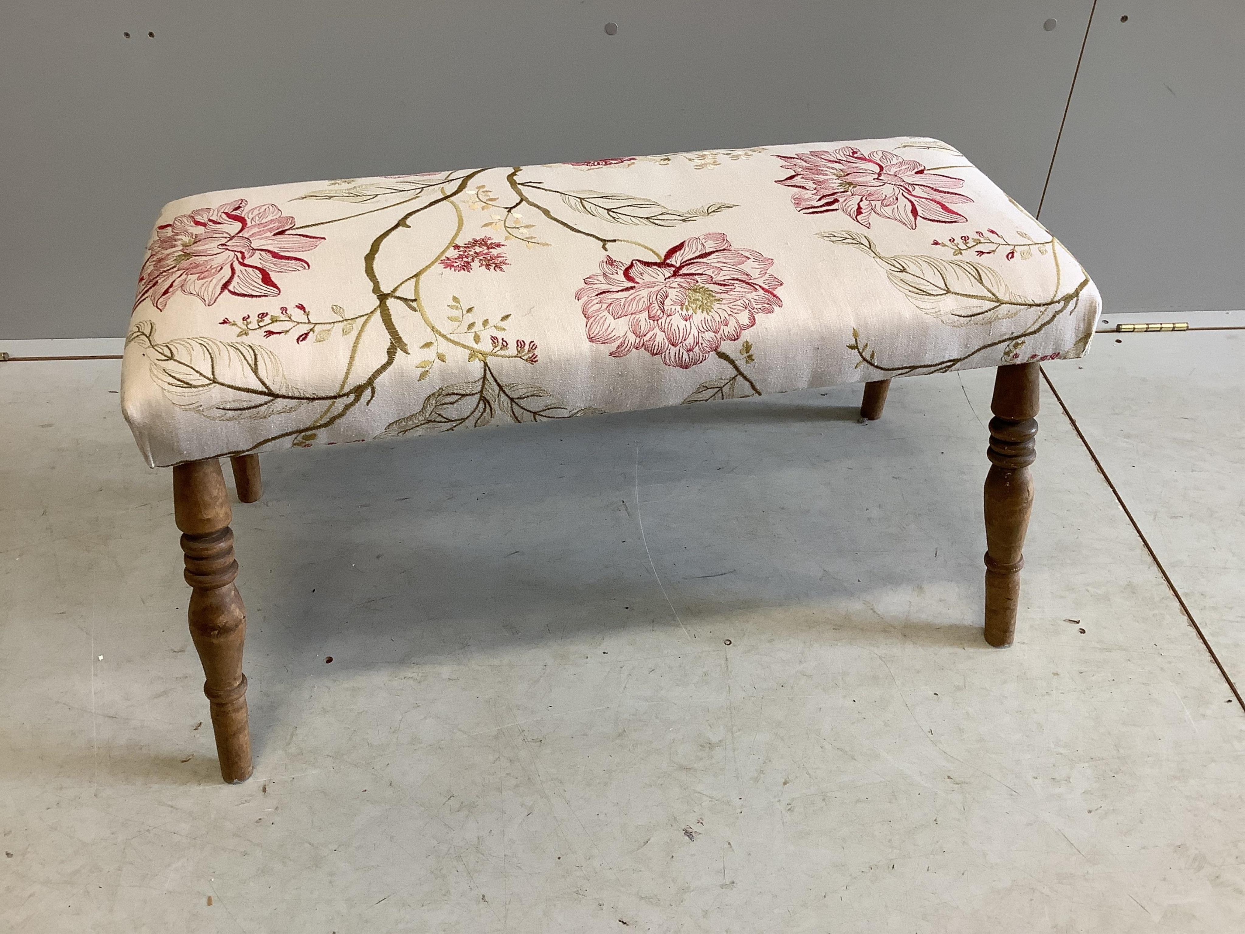 A Louis XVI style elbow chair and associated footstool upholstered in Voyage? fabric, chair width 65cm, depth 56cm, height 94cm. Condition - fair to good